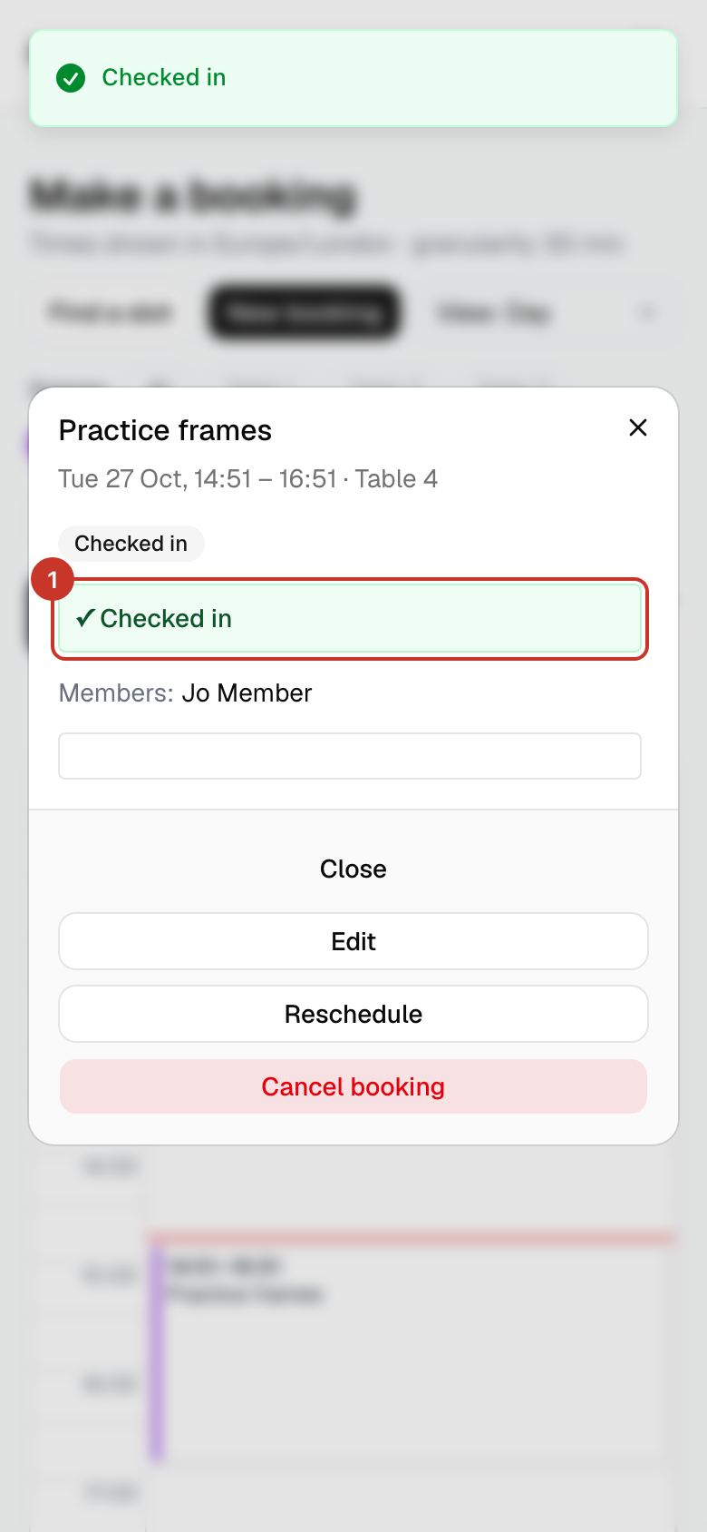 A green ✓ Checked in message appears and the booking’s status changes to Checked in. The window closes by itself after a moment.